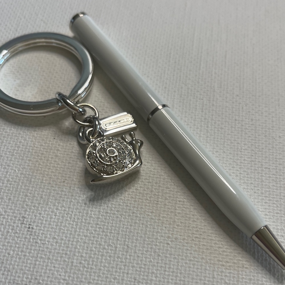 Coach Sparking Snail Keychain with White Coach Pen
